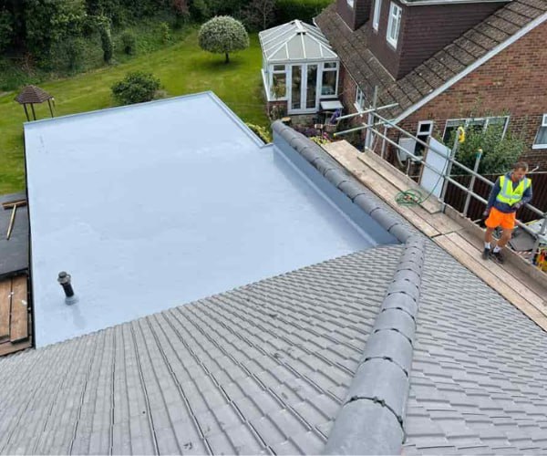 This is a photo of a newly installed hip roof, with a combined liquid covered flat roof. Work carried out by DHG Roofing Shefford